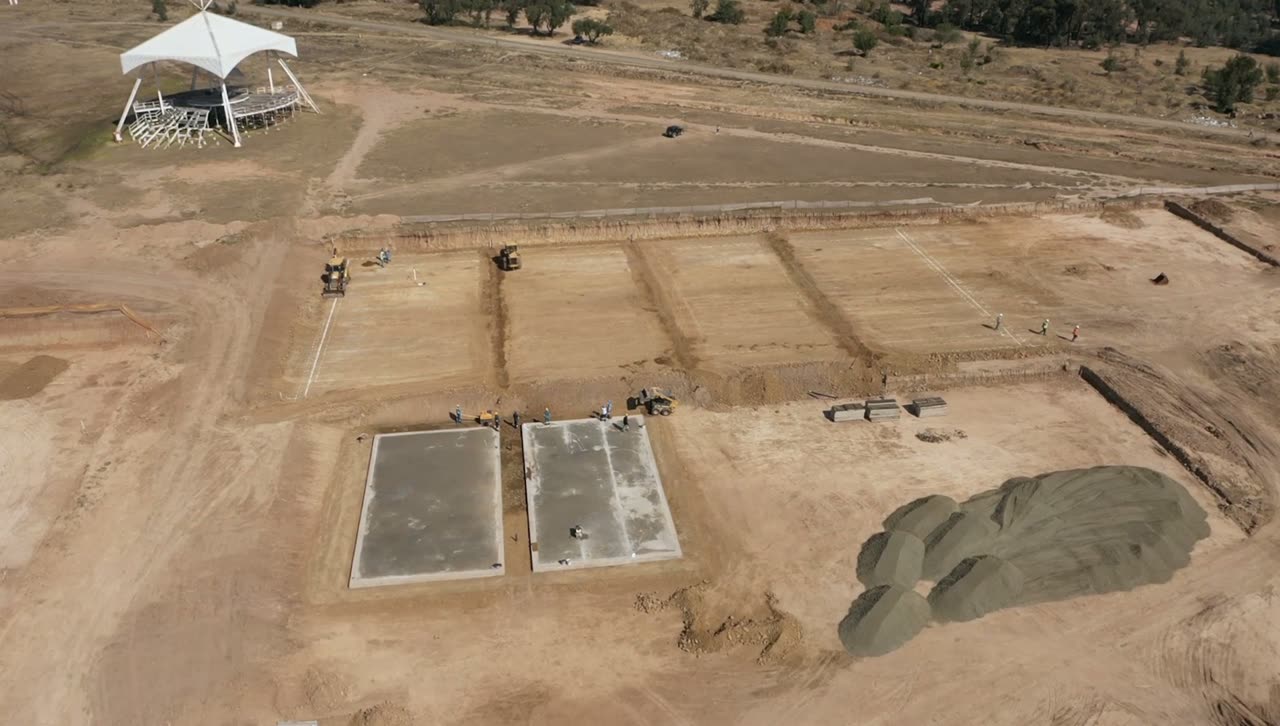 Earthworks and the first foundation slabs on the sports field